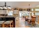 Eat-in kitchen with island, white cabinets, and hardwood floors at 1719 Cat Tail Ct, Lawrenceville, GA 30044