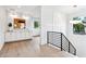 Bright hallway with hardwood floors and modern staircase at 1413 Windsor Ne Pkwy, Brookhaven, GA 30319