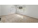 Living room featuring neutral carpeting and a large window at 3589 Orchard Cir, Decatur, GA 30032