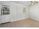 Simple dining area with tile flooring and a door to backyard at 3589 Orchard Cir, Decatur, GA 30032