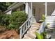 Steps leading to the front porch, surrounded by landscaping at 3589 Orchard Cir, Decatur, GA 30032