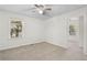 Well-lit bedroom with ceiling fan and access to another room at 3589 Orchard Cir, Decatur, GA 30032