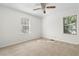 Bright bedroom featuring neutral carpeting and ceiling fan at 3589 Orchard Cir, Decatur, GA 30032