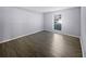 Bright bedroom with wood-look floors and large window at 1002 Cumberland Se Ct, Smyrna, GA 30080