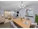 Virtually staged dining and living room with hardwood floors at 1002 Cumberland Se Ct, Smyrna, GA 30080