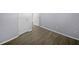 Spacious bedroom with wood-look floors and neutral walls at 1002 Cumberland Se Ct, Smyrna, GA 30080