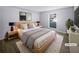 Virtually staged bedroom with light walls and hardwood floors at 1002 Cumberland Se Ct, Smyrna, GA 30080