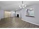 Virtually staged living room with hardwood floors at 1002 Cumberland Se Ct, Smyrna, GA 30080