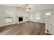 Living room with stone fireplace and hardwood floors at 2523 Mistletoe Ln, Snellville, GA 30039
