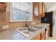 Kitchen sink and countertops with tile backsplash at 4638 Burnt Fork Cir, Douglasville, GA 30135