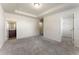 Main bedroom with gray carpet, en-suite bathroom, and walk-in closet at 6327 Olmadison Pl, South Fulton, GA 30349