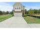 Two-story home with stone accents and a two-car garage at 5760 Tillman Way, Powder Springs, GA 30127