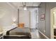 Main bedroom with exposed brick wall and a grey comforter at 426 Marietta Nw St # 309, Atlanta, GA 30313