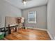 Versatile bedroom with hardwood floors and a window at 1825 Center Ave, Atlanta, GA 30344