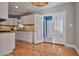 Open concept kitchen with white cabinets and granite countertops at 1825 Center Ave, Atlanta, GA 30344