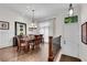 Elegant dining room with hardwood floors, chandelier, and large windows at 3637 Habersham Nw Rd # 46, Atlanta, GA 30305
