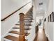 Elegant wooden staircase with iron railings leading to the upper level at 3637 Habersham Nw Rd # 46, Atlanta, GA 30305