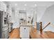 Open concept kitchen with island, stainless steel appliances, and hardwood floors at 3637 Habersham Nw Rd # 46, Atlanta, GA 30305
