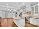 Spacious kitchen boasts stainless steel appliances, granite island, and hardwood floors at 3637 Habersham Nw Rd # 46, Atlanta, GA 30305