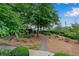 Landscaped community courtyard with walking path and benches at 3637 Habersham Nw Rd # 46, Atlanta, GA 30305