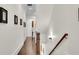 Long hallway with hardwood floors and framed pictures on the wall at 3637 Habersham Nw Rd # 46, Atlanta, GA 30305