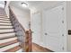 Elegant staircase with dark wood railings and flooring at 3637 Habersham Nw Rd # 46, Atlanta, GA 30305