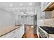 Eat-in kitchen with granite countertops, stainless steel appliances, and hardwood floors at 3637 Habersham Nw Rd # 46, Atlanta, GA 30305