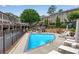 Community pool with lounge chairs and surrounding landscaping at 3637 Habersham Nw Rd # 46, Atlanta, GA 30305