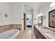 Elegant bathroom with double vanity, soaking tub, and walk-in shower at 3637 Habersham Nw Rd # 46, Atlanta, GA 30305