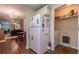 Kitchen with white appliances, pantry, and laundry closet at 1905 Millers Path, Cumming, GA 30041