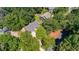 Aerial view of house surrounded by lush green trees at 1905 Millers Path, Cumming, GA 30041