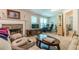 Bright living room featuring a stone fireplace and built-in entertainment center at 1905 Millers Path, Cumming, GA 30041