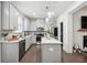 Modern kitchen with gray cabinets, island, and stainless steel appliances at 47 S Auburn Landing Pl, Auburn, GA 30011