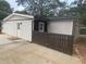 White exterior with brown accents and fence at 369 Bell Se St, Marietta, GA 30060