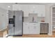 Modern kitchen features white shaker cabinets and stainless steel appliances at 369 Bell Se St, Marietta, GA 30060