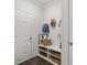 Convenient mudroom with bench, cubbies, and hooks for coats at 3856 Kastler Dr, South Fulton, GA 30349
