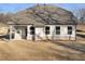 Rear view of a house with a large backyard at 3867 Kastler Dr, South Fulton, GA 30349