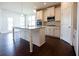Eat-in kitchen with island, stainless steel appliances, and hardwood floors at 3864 Kastler Dr, South Fulton, GA 30349