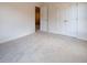Bedroom with carpet and double doors to closet at 3864 Kastler Dr, South Fulton, GA 30349