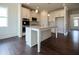 Island kitchen with stainless steel appliances and hardwood floors at 3864 Kastler Dr, South Fulton, GA 30349