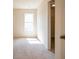 Bedroom with carpet, window, and closet at 3864 Kastler Dr, South Fulton, GA 30349