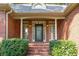 Inviting front porch with brick steps and landscaping at 4020 Brookwood Ter, Mcdonough, GA 30253