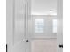 Simple bedroom with two windows and carpet flooring at 1958 Dillon Dr, Lithonia, GA 30058