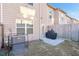 Private backyard with patio, grill, and fenced area at 1958 Dillon Dr, Lithonia, GA 30058