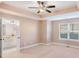Bright bedroom with ensuite bathroom and ceiling fan at 1958 Dillon Dr, Lithonia, GA 30058