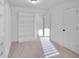 Bright bedroom with built in shelving and double closets at 1958 Dillon Dr, Lithonia, GA 30058