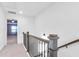 Upstairs hallway with access to bedrooms and a staircase at 1958 Dillon Dr, Lithonia, GA 30058