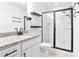 Bathroom with shower, granite countertop and floating shelves at 1958 Dillon Dr, Lithonia, GA 30058
