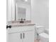 Small bathroom with granite countertop and white cabinets at 1958 Dillon Dr, Lithonia, GA 30058