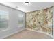 Charming bedroom featuring a tropical-themed accent wall at 1958 Dillon Dr, Lithonia, GA 30058